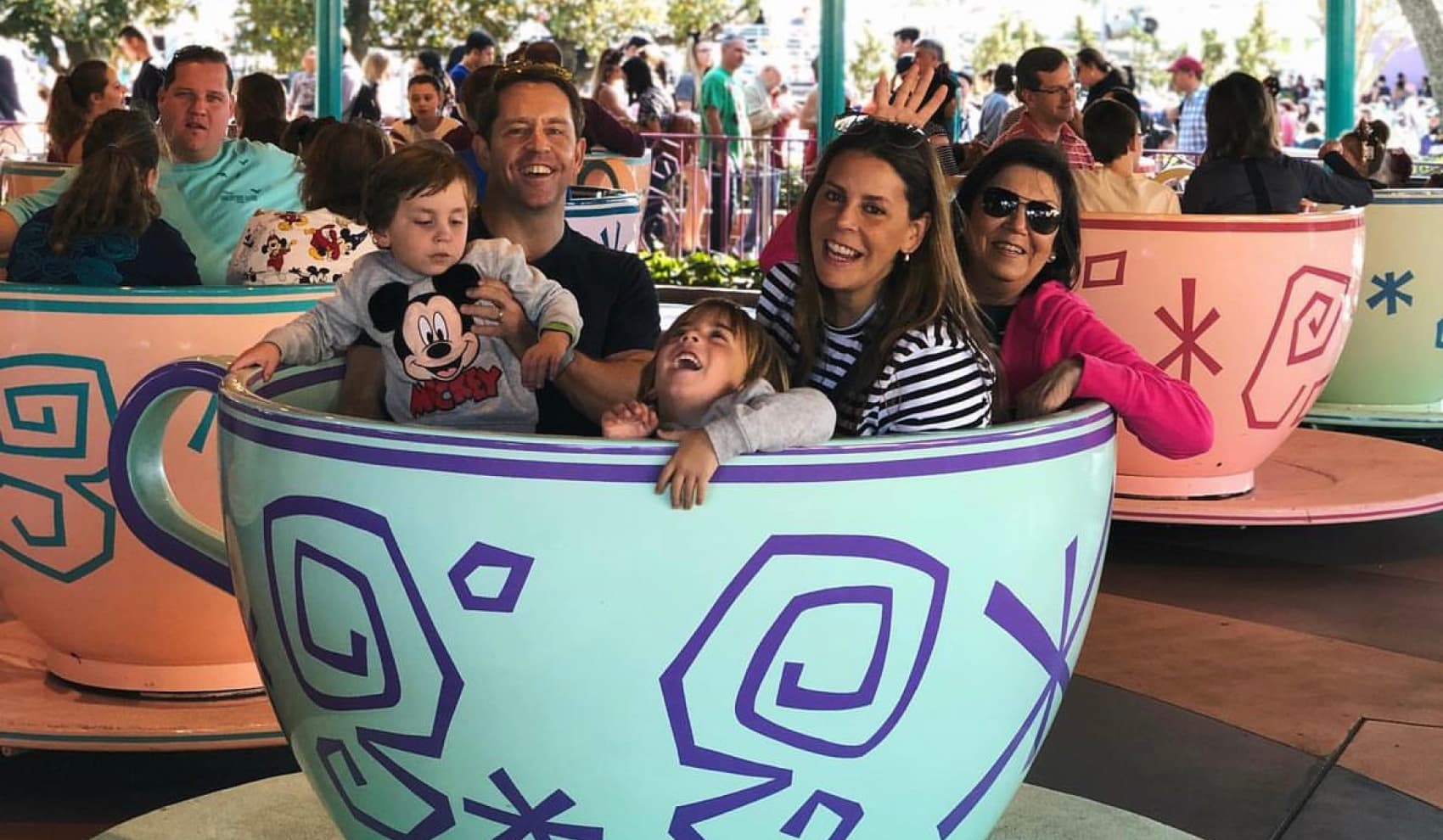 A young princess posing for a photo in front of a fairy tale backdrop